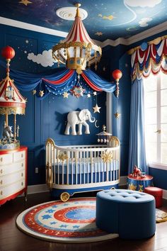 a baby's room decorated in blue and red with an elephant bedding set