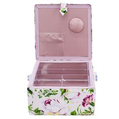 an open pink and white floral suitcase with flowers on it's sides, sitting in front of a white background