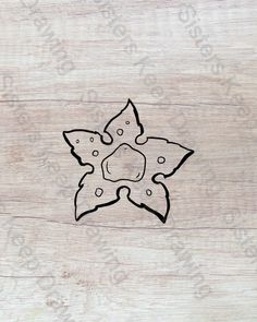 an image of a flower on wood