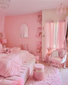 a bedroom decorated in pink and white with fluffy rugs on the floor, chandelier hanging from the ceiling