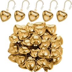 a bunch of gold hearts hanging from chains