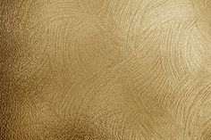 gold metallic textured paper with wavy lines on the edges and bottom, viewed from above