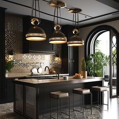 a kitchen with an island, stools and lights hanging from it's ceiling