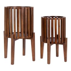 two wooden stools sitting next to each other