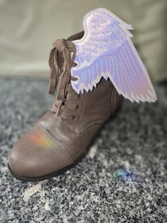 This listing is for a pair of wings,  white iridescent Raven with detailed embroidered wings 6.85 inches high to tip of wing These lace onto boots or skates with the shoe laces thru matching eyelets on the shoes. Shoe Wings Diy, Roller Skate Wings, Wings For Shoes, Winged Shoes, Wings Backpack, Wing Shoes, Roller Skate, Roller Skates, Roller Skating