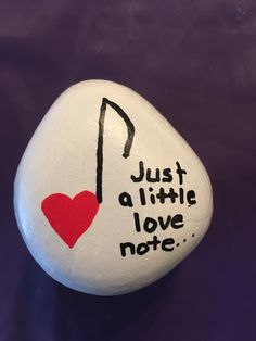 a rock with writing on it that says, just a little love note