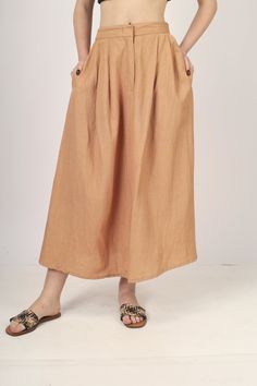 Beige Pleated Maxi skirt for women skirt, Long skirt, Custom made, Made to order, Plus size -Model height: 5'5" wearing size S -Length: 33" -Fit: A-line -Closure: Front button and zipper Brown High Waist Maxi Skirt For Summer, Full Length Flowy Skirt With Pockets, Relaxed Maxi Skirt With Pockets, Full-length Skirt With Pockets, High Waist Brown Maxi Skirt For Summer, Wide Leg Pleated Skirt With Pockets, Full Length Lined Pleated Skirt, Flowy Skirt With Pockets, Flowy Full Skirt In Beige