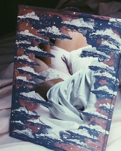 an altered photograph of a person laying in bed