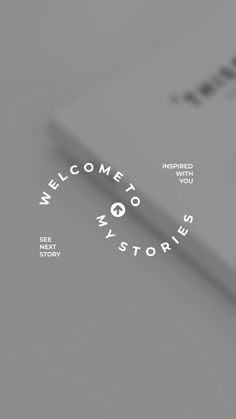 the welcome to my stories logo is displayed on a notebook