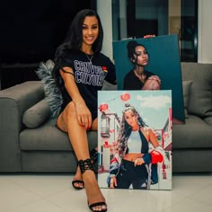 a woman sitting on top of a couch next to a painting and an image of herself