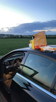 there is a bag on top of the car's dash board in front of it