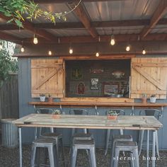 an outdoor bar with several stools and tables