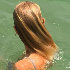 the back of a woman's head in water