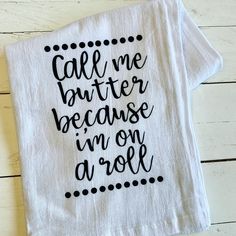 a tea towel with the words call me butter because i'm on a roll