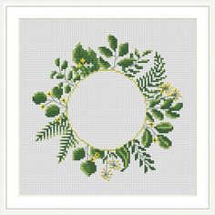 a cross stitch pattern with green leaves and yellow flowers in the center on a white background