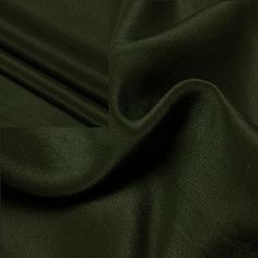 dark green satin fabric close up