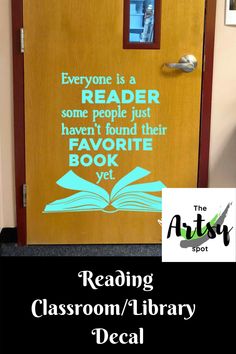 a door with the words reading classroom library decal on it and an open book