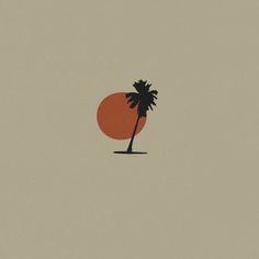 an orange and black palm tree in front of a gray sky with the sun behind it