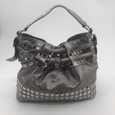 Rebecca Minkoff Devote Tote Hobo Handbag Bucket Bag Metallic Silver Studded Heavy Approximate Measurements: 14" W X 11" T 6.25: Handle Drop Good Pre-Owned Condition. Stain On Lining (See 8th Photo). Some Light Scratches From Wear On Studs. No Rips Or Holes. Please See Photos For Condition Details. From A Smoke-Free, Pet-Friendly Home. Designer Shoulder Bag With Metal Hardware For Daily Use, Designer Shoulder Bag For Daily Use With Metal Hardware, Designer Satchel Shoulder Bag For Errands, Designer Bucket Hobo Bag For Shopping, Designer Bags With Metal Hardware For Daily Use, Designer Rectangular Hobo Bag For Errands, Luxury Hobo Bag With Adjustable Strap, Evening Satchel With Gunmetal Hardware, Designer Bucket Hobo Bag