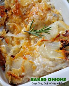 baked onions in a casserole dish with a sprig of rosemary