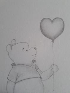 a drawing of a bear holding a heart shaped balloon