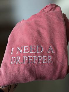 Embroidered "I need a Dr. Pepper Sweatshirt, minimalist funny Crewneck, Embroidered Crewneck Shirt, for Fall or Winter Seasons! This embroidered "I Need A dr. pepper" Sweatshirt is everything. Perfect for showing your Dr. Pepper Love!! Gildan Brand Sweatshirts Unisex  50% Cotton/50% Polyester but SUPER Soft🤗  Pre-shrunk😱  Relaxed fit😋 Care: Machine wash: warm (max 40C or 105F) Tumble dry: low Do not iron directly on the print REFUNDS AND EXCHANGES All items are handmade by myself personally. I Need A Dr Pepper Sweatshirt, Dr Pepper Merchandise, Dr Pepper Sweatshirt, Dr Pepper Merch, Dr Pepper Gifts, Dr Pepper Gift Ideas, Dr Pepper Stuff, Cute Items To Buy, Dr Pepper Aesthetic