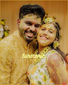 a man and woman covered in yellow powder posing for a photo with the words turmec on their face