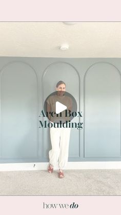 a man standing in front of a blue wall with the words after box moulding