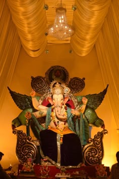 an elephant statue sitting in the middle of a room