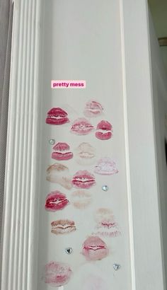 there are many different lipsticks on the wall