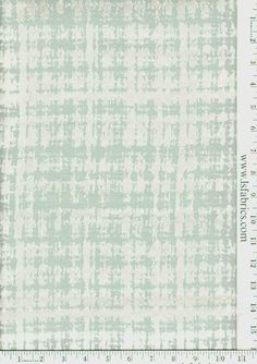 a white and green plaid pattern on fabric with a ruler in front of the image