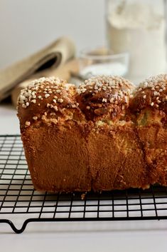 a loaf of bread sitting on top of a cooling rack