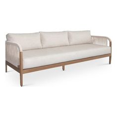 a white couch sitting on top of a wooden frame