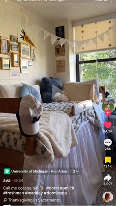 a bed room with a neatly made bed and pictures on the wall next to it