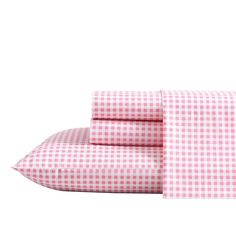 pink gingham checkered sheets and pillowcases with matching pillows on them