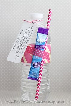 a bottle filled with water and some paper straws