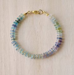 Fluorite is said to absorb and neutralize negative energy & stress. It is also believed to increase concentration, self-confidence, and help in decision-making. This bracelet is handcrafted with genuine Fluorite ranging blues, greens, and purples. Each stone is slightly different in width and has a tiny gold or silver bead between. STONE SIZE: 6mm SIZING: Please measure your wrist to find your size before purchasing. If purchasing as a gift the adjustable size of 6.5 to 7.5" fits most average wo Fusion Style Healing Bracelets With Gemstone Beads, Handmade Fluorite Beaded Bracelets As Gift, Handmade Fusion Bracelet For Healing, Fluorite Gemstone Bracelets With Round Beads, Fluorite Natural Stone Beaded Bracelets As Gift, Handmade Adjustable Fluorite Bracelets, Spiritual Fluorite Bracelets With Gemstone Beads, Spiritual Fluorite Bracelets With Natural Stones, Handmade Spiritual Fluorite Bracelets