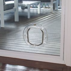 a glass door with a metal ring on it