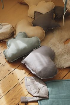 several pillows are laying on the floor next to each other