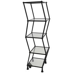 three tiered metal shelf with glass shelves on each side and black wheels, against a white background