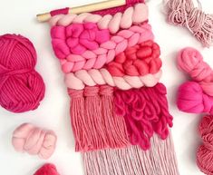 yarn and knitting needles laid out on a white surface