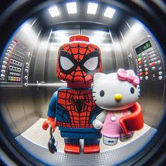 a hello kitty and spiderman character are seen through a round hole in an elevator