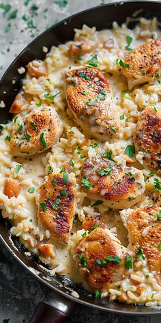 chicken and rice in a skillet with parsley sprinkled on the side