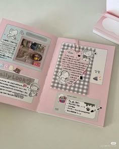 an open pink book with pictures and writing on it