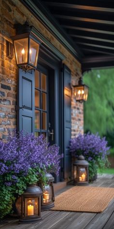 purple flowers and candles are on the front porch