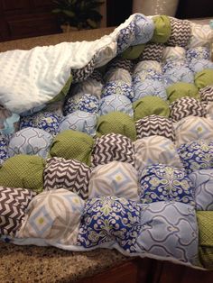 a close up of many pillows on a counter