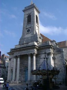 an old building with a clock tower on it's side