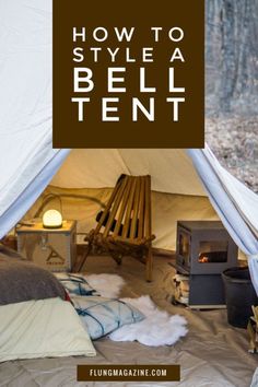 a tent with the words how to style a bell tent in front of it and an open fire place