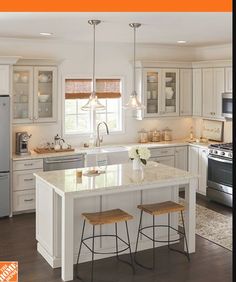 a kitchen with an island and two stools