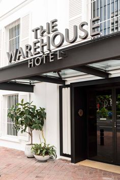 the warehouse hotel sign is above the entrance